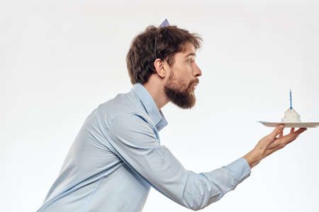 Happy guy with birthday cake white background Compact corporate party cropped beard view