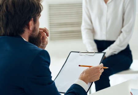 Male psychologist next to the patient communication psychotherapist consultation problemの写真素材