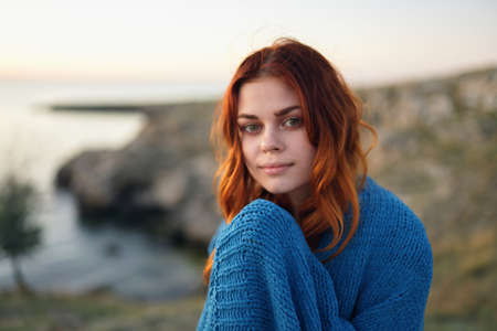 cheerful pretty woman outdoors mountains cool blue plaid