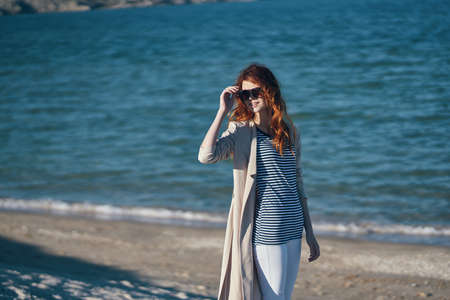 the traveler strolls along the beaches near the sea in the mountains waves landscape summer