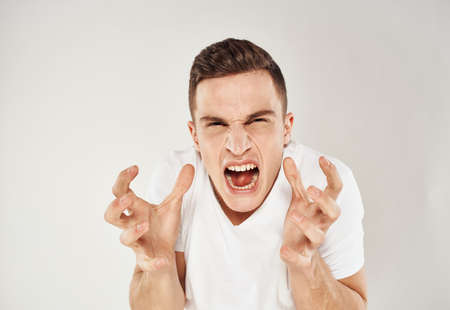 Aggressive man gestures with his hands nervousness madness modelの写真素材