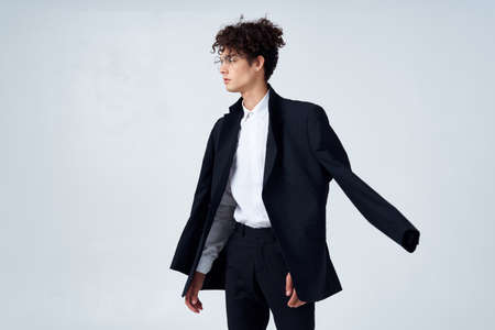 man in black blazer curly hair fashion modern style business suitの写真素材