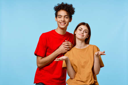 cheerful young couple hugs communication fun fashionの写真素材