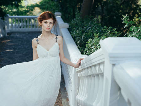 Woman in white dress on nature mythology decoration modelの写真素材