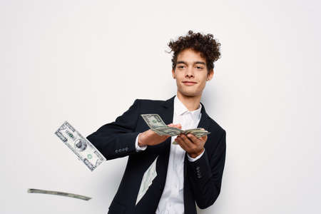 man in suit curly hair money business self confidenceの写真素材