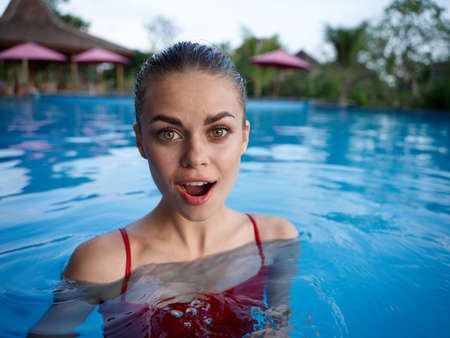 surprised woman in a swimsuit Swimming in the pool island rest