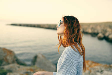 Cheerful woman travel landscape nature walk fresh airの写真素材