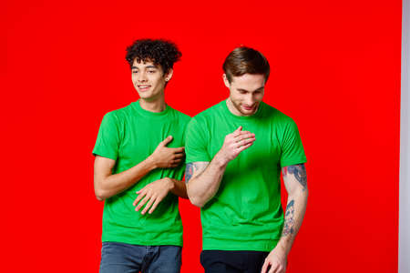 two men green t-shirt communication studio teamの写真素材
