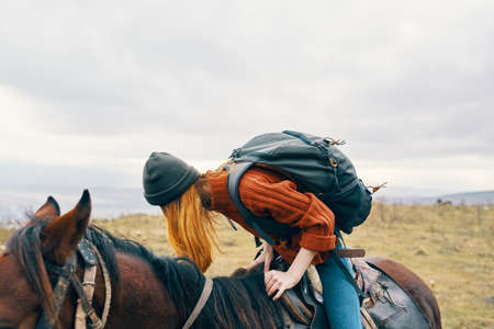 woman tourist sitting on horse fresh air adventure rideの写真素材