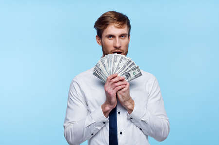business man in shirt with tie bundle of money finance wealthの写真素材