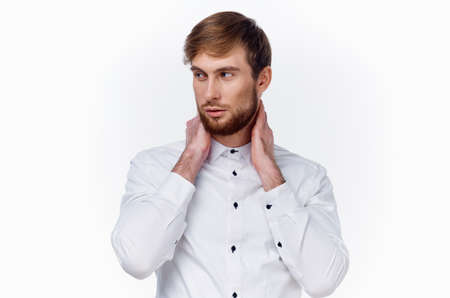 business man in white shirt gesturing with hands on light background cropped view