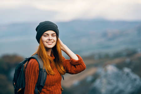 cheerful woman hiker mountains nature landscape travel vacationの写真素材