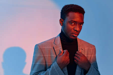 man of african appearance with suit holding jacket fashion studio