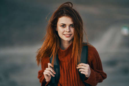 Traveling with a backpack loose hair tourism mountains natureの写真素材