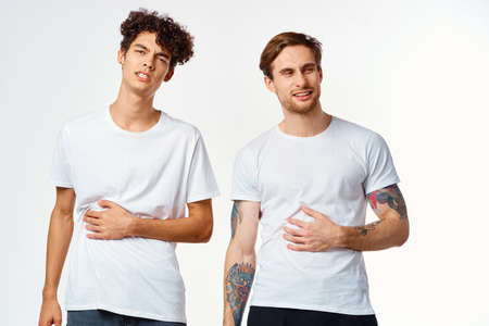 emotional two friends in white t-shirts yes fun studio