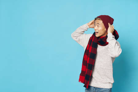 man of asian appearance in winter clothes fashion modern style isolated backgroundの写真素材