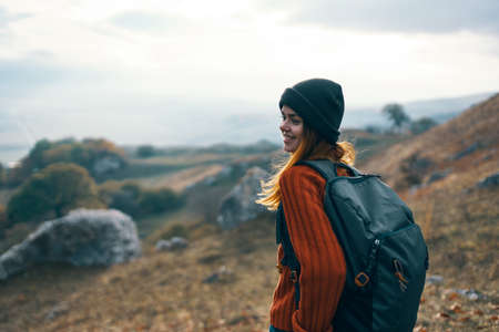 cheerful woman hiker nature freedom landscape lifestyleの写真素材