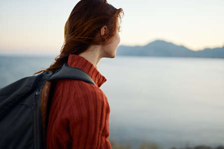 portrait woman travels in the mountains outdoors near the sea cropped viewの写真素材