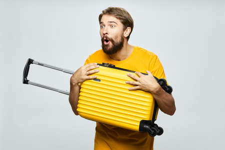 man with yellow suitcase vacation travel passenger flight