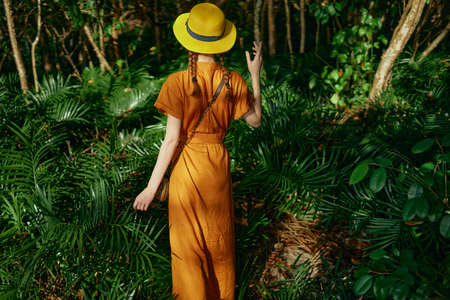 woman tourist in hat on the island exotic jungle travelの写真素材