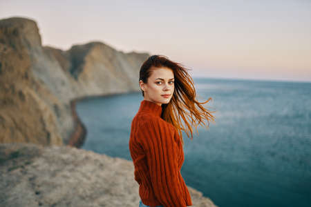 Traveler with backpack mountains sunset sea ocean modelの写真素材