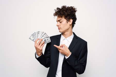Cheerful guy with curly hair in suit official isolated background