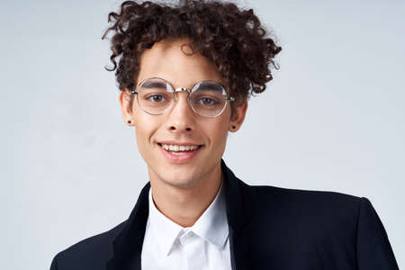 cute guy in a suit curly hair glasses fashionの写真素材