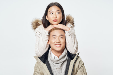 man and woman from above on a light background friends fun emotions asian appearanceの写真素材