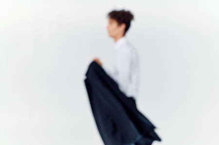 curly-haired guy with a jacket fashion self-confidence business suit