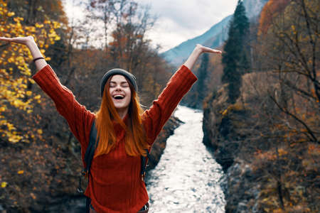 cheerful woman tourist freedom mountains travel riverの写真素材