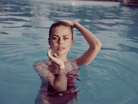 woman in swimsuit in the pool attractive look leisure lifestyle