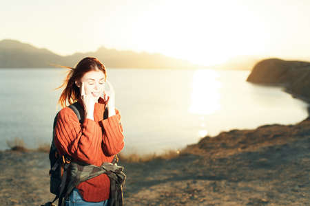woman with backpack travel rocky mountains walk lifestyleの写真素材