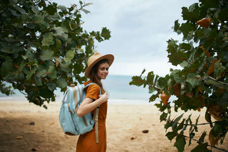 woman tourist in a hat with a backpack on the island travel exoticの写真素材