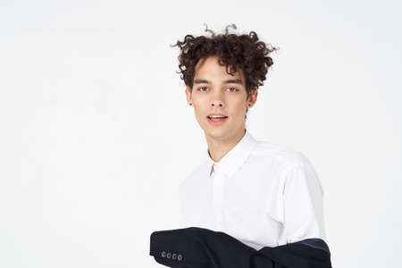 parkneft handsome man in shirt and jacket on light background curly hair suit model