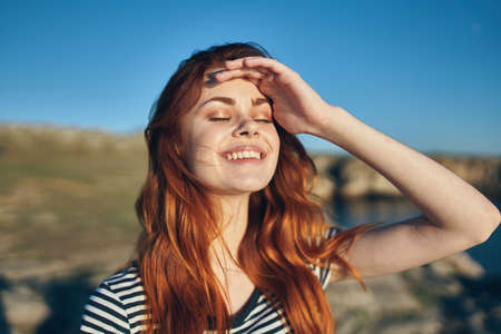 happy woman on the beach in the mountains near the river high cliffs landscape fresh airの写真素材