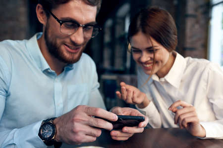 business man and woman in cafe breakfast leisure communication technologyの写真素材