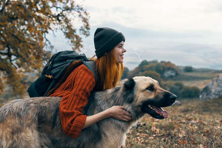 hiker in nature with dog travel friendship landscapeの写真素材