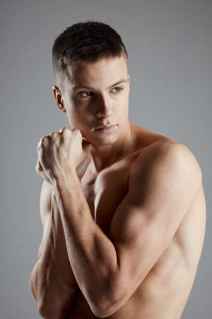 attractive man with bulging arm muscles boxer bodybuilder fitnessの写真素材