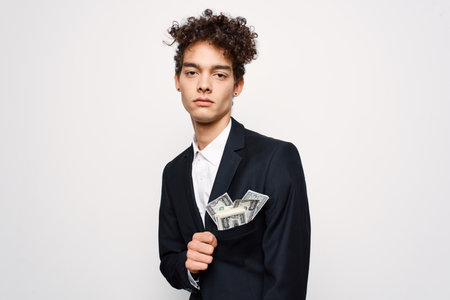 man in suit curly hair money business self confidenceの写真素材