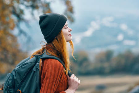 woman hiker backpack travel in mountains landscape funの素材 [FY310169823773]