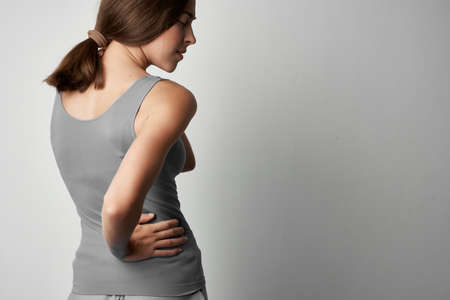 woman with back pain medicine treatment health problems