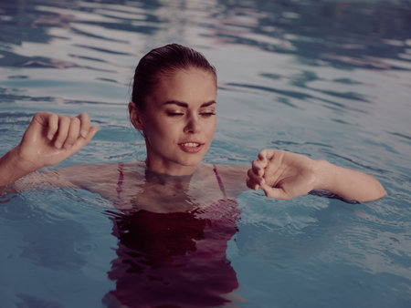woman in red swimsuit Swimming in the pool vacation luxury travel natureの写真素材