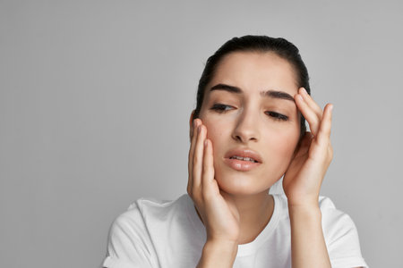woman with headache discontent health problems close upの写真素材