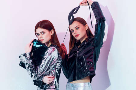 two glamorous women fashion clothing modern style party nightclub