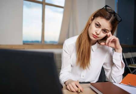 Business woman in office in front of laptop technology professional communicationの写真素材