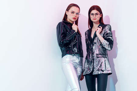 pretty women stand beside fashion clothes studio sexy styleの写真素材