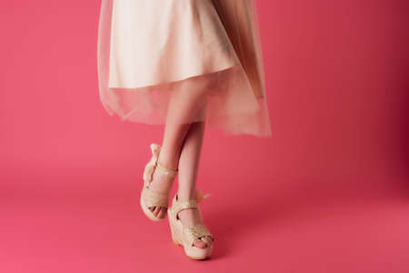 fashion shoes cropped view female feet pink background cropped viewの写真素材