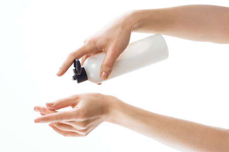 lotion in female hands moisturizing and skin care healthの写真素材