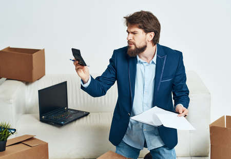 business man unpacking things new place of work office
