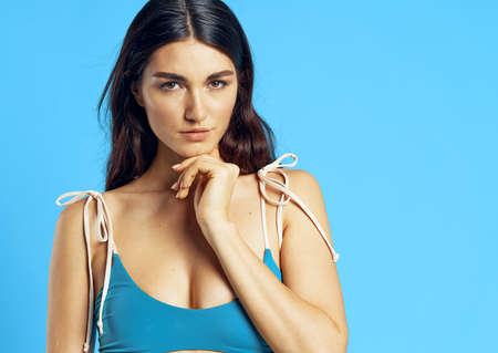 pretty woman in blue swimsuit attractive look Glamor fashion blue backgroundの写真素材